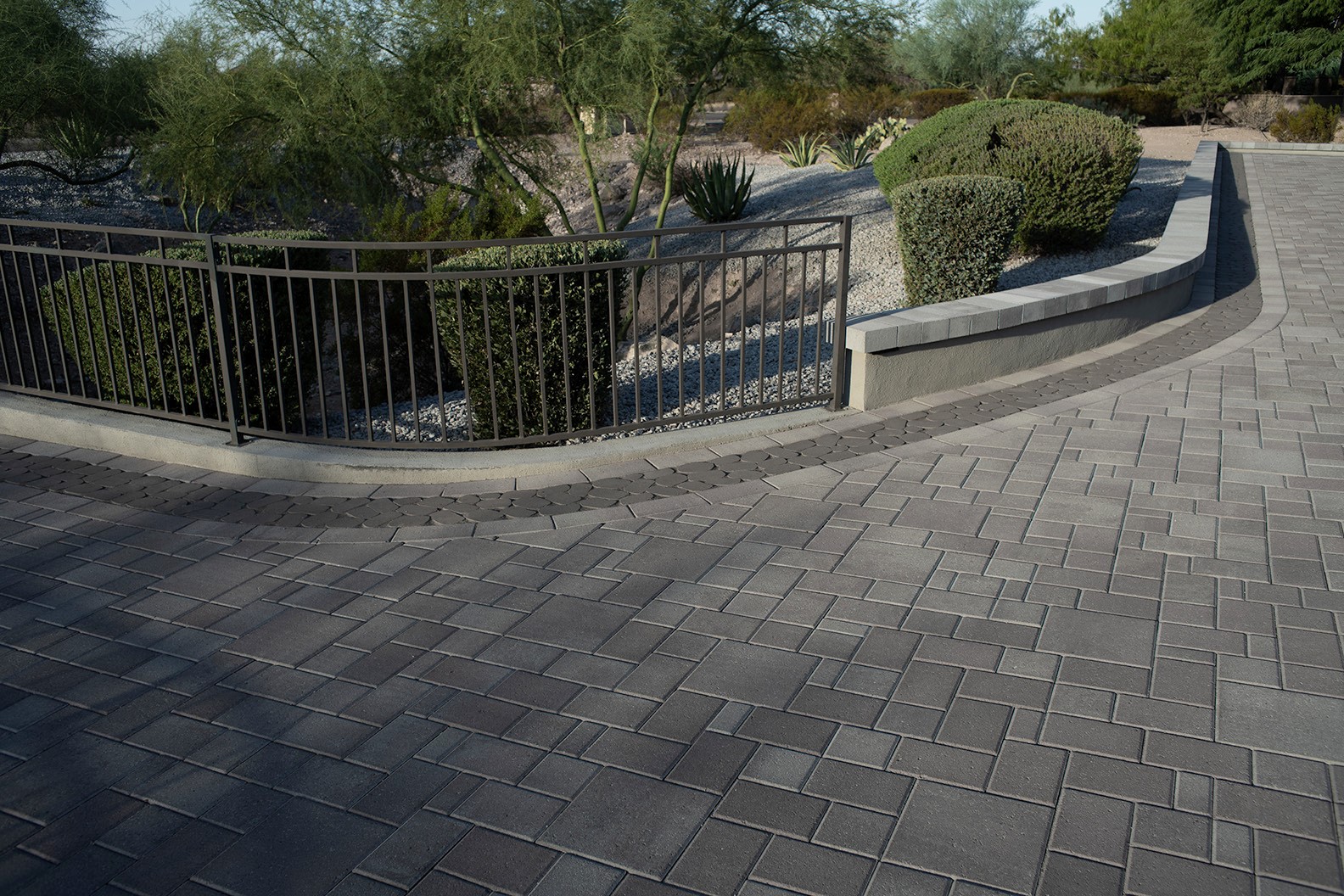Stone Creations team installing pavers